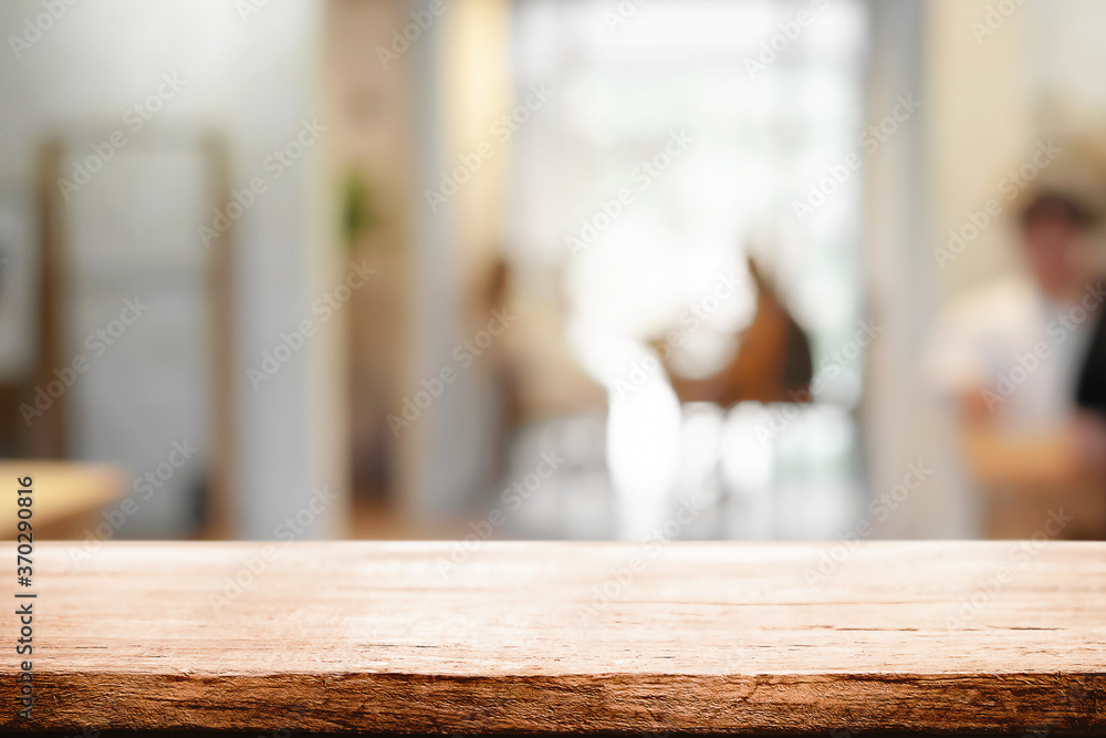 Cafe or Restaurant blurred background with empty wood montage. Cafe or Restaurant blurred background with empty wood montage.