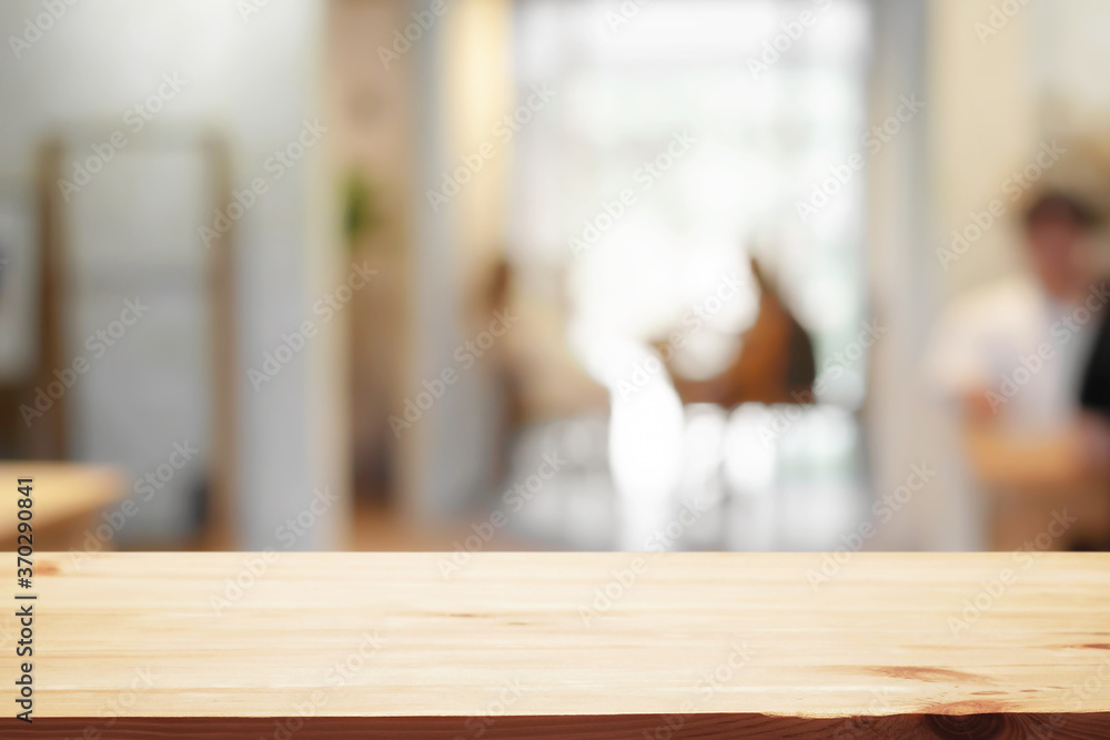 Cafe or Restaurant blurred background with empty wood montage. Cafe or Restaurant blurred background with empty wood montage.