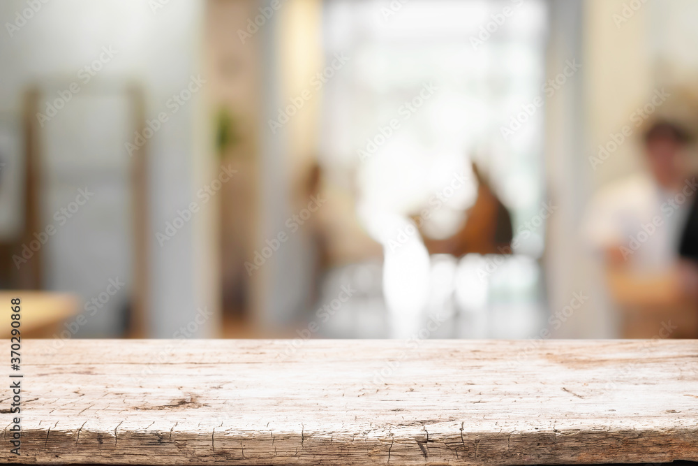 Cafe or Restaurant blurred background with empty wood montage. Cafe or Restaurant blurred background with empty wood montage.