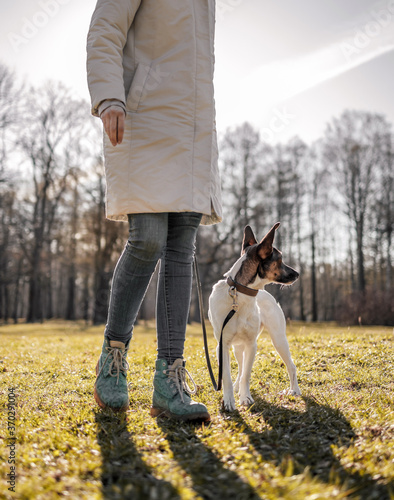 Girl's training a dog in the park..