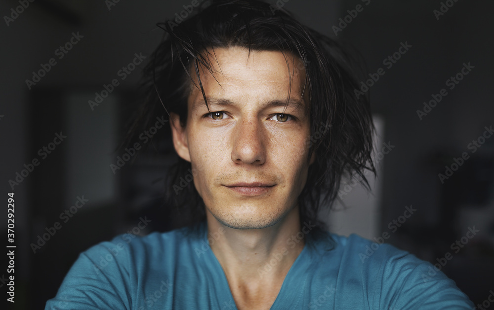 A close male dark portrait in the room A close male dark portrait in the room