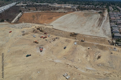 Aerial View of Excavator Moving Dirt on Construction Project