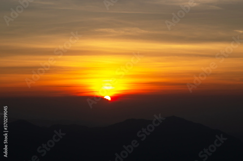 The peak of mountain with beautiful sunrise at point view. Good morning 