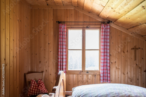 Holiday in the mountains: Rustic old wooden interior of a cabin or alpine hut photo