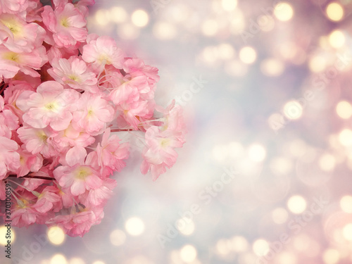 spring background flowering white sakura cherry flowers tree and abstract bokeh