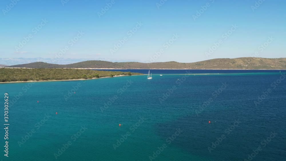 Amazing seascape on Adriatic sea, turquoise water on the island of Dugi Otok in Croatia, Velebit mountain in background, aerial view from drone Amazing seascape on Adriatic sea, turquoise water on the island of Dugi Otok in Croatia, Velebit mountain in background, aerial view from drone