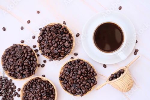 Top view coffee cup and coffee beans on old wood table background, space for text