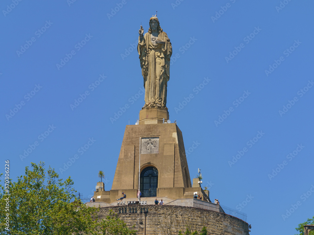 Mountain Urgull, The hill is topped by stronghold. Conspicuous 12 metre-long sculpture of Jesus Christ added in 1950, towering over the bay.