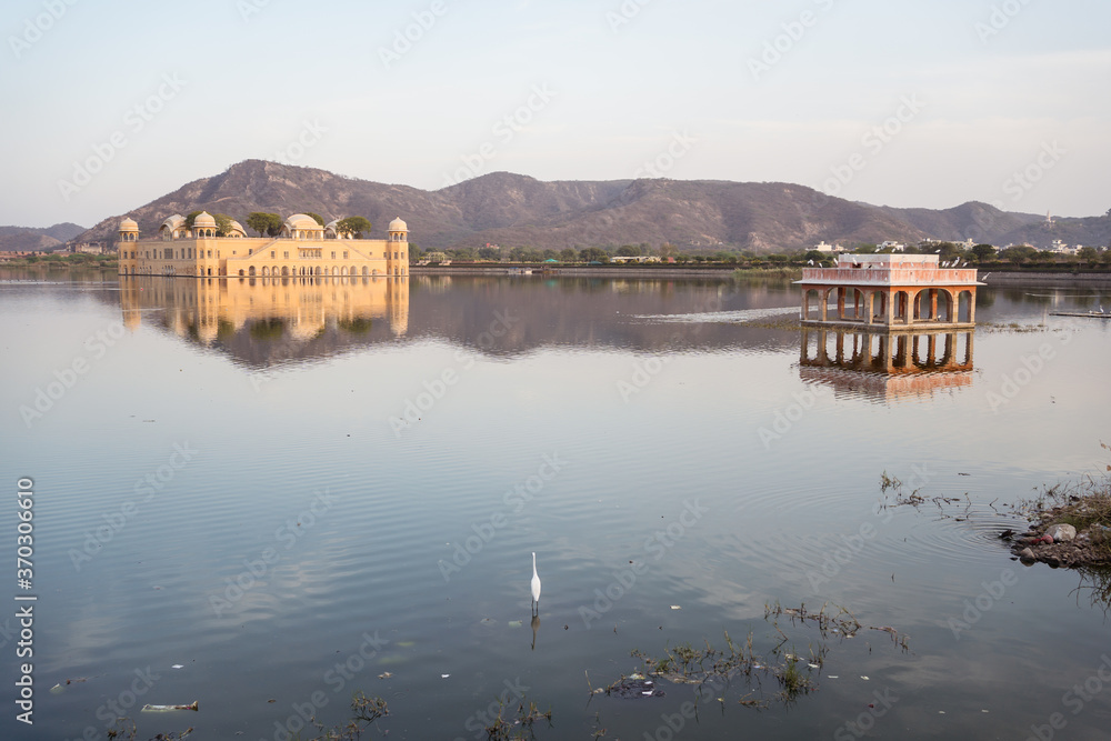 Landscape of the Jal Mahal with reflection in water of the surrounding lake in Jaipur