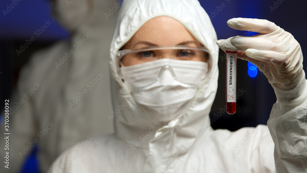 Scientist testing sample for Coronavirus in tube Scientist testing sample for Coronavirus in tube