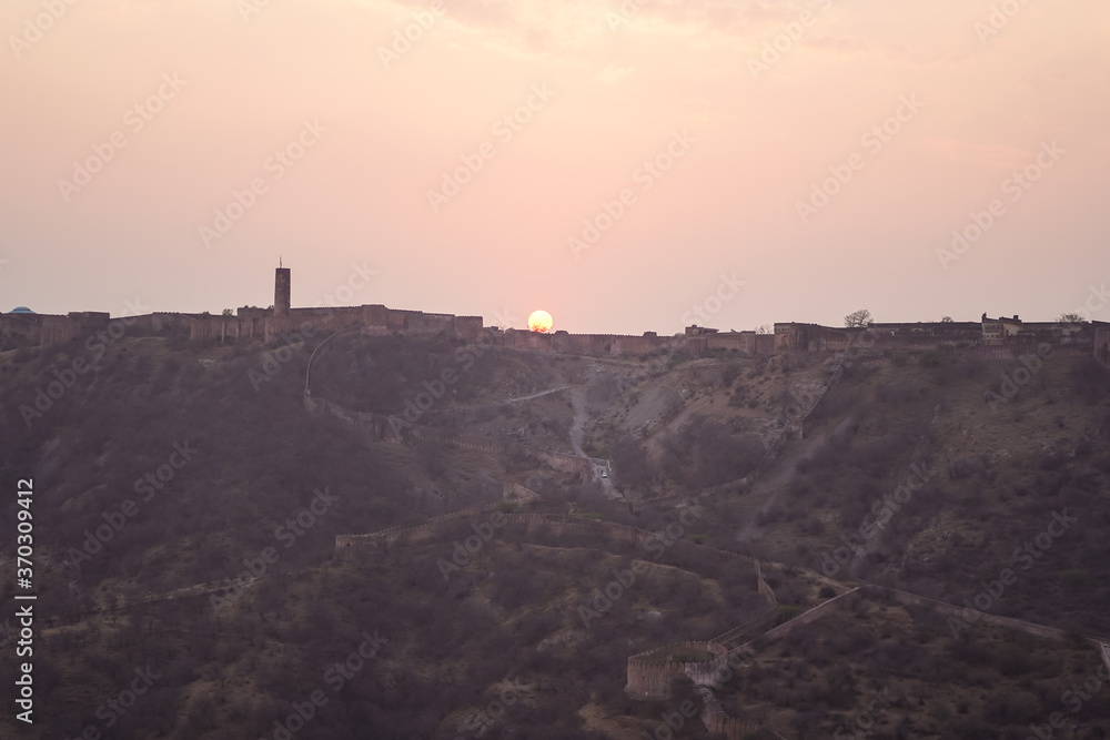 Sun setting over ramparts along Amber Fort