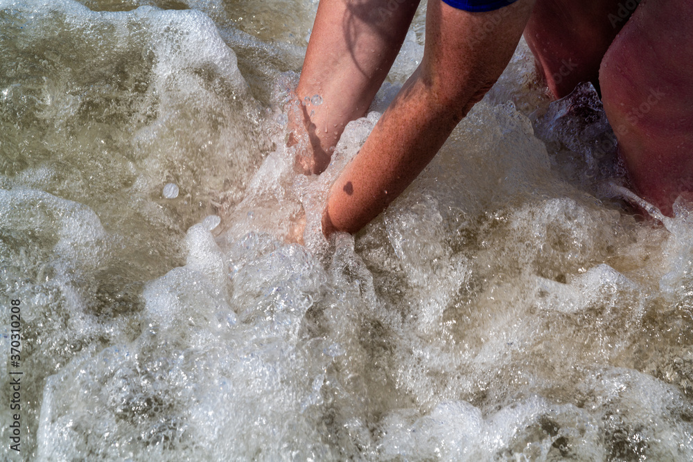 Fototapeta premium woman having fun in the sea with a lot of splashes