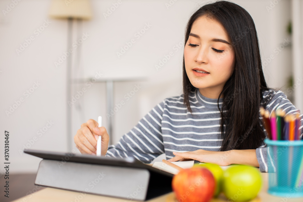 Online Video Call Conference of Work Team from Home Office.Smiling young asian woman blogger vlogger influencer sit at home speaking.online with internet teacher learn language talk .young woman make Online Video Call Conference of Work Team from Home Office.Smiling young asian woman blogger vlogger influencer sit at home speaking.online with internet teacher learn language talk .young woman make