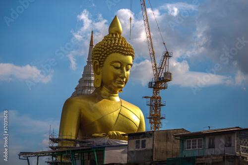 Close-up natural background of the waterfront community  a large Buddha statue  Wat Paknam Phasi Charoen  stands beautifully  seen in tourist attractions in Bangkok  Thailand.