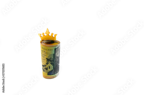 Stack of Australian 50 dollars banknotes with golden crown isolated over white background with copy space, cash is king concept image photo