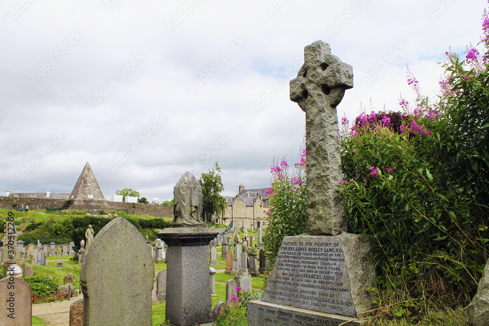 Stirling, Scotland - August 1, 2020, old medieval cemetery around Port of Menteith Parish Church. Stirling, Scotland - August 1, 2020, old medieval cemetery around Port of Menteith Parish Church.