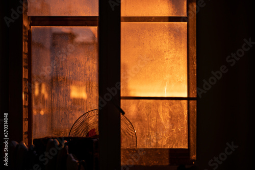old window in the evening during sunset