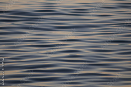 ripples in water, tranquil sea, soft focus.