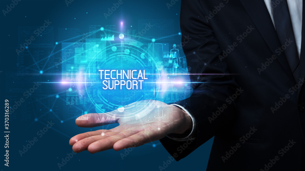 Man hand holding TECHNICAL SUPPORT inscription, technology concept Man hand holding TECHNICAL SUPPORT inscription, technology concept