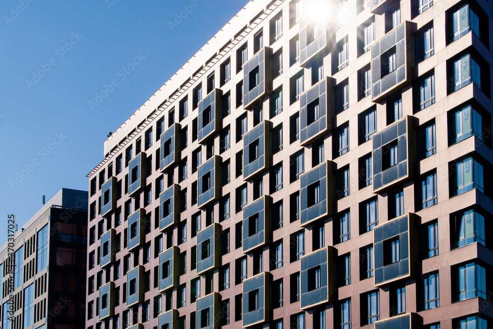 Exterior of modern architecture in the city center. Construction abstract background. Detail of the facade with windows.