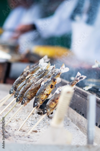 Japanese Fishes grilling, Delicious traditional food in Arashiyama, Kyoto, Japan. Asia travel and Street food concept