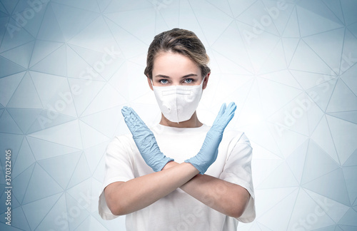Woman in mask stops coronavirus, gray