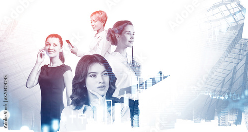 Four businesswomen in modern city