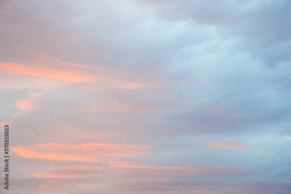 Magic pink-blue sky with clouds at dawn, sunrise and sunset, atmosphere. Beautiful landscape, background. Copy space.