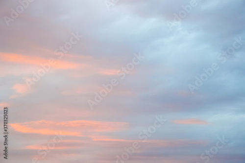 Magic pink-blue sky with clouds at dawn, sunrise and sunset, atmosphere. Beautiful landscape, background. Copy space. © Marina_Nov