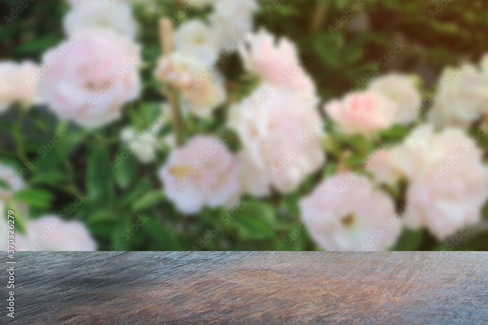 Empty wooden table background with beautiful roses for background. Empty wooden table background with beautiful roses for background.
