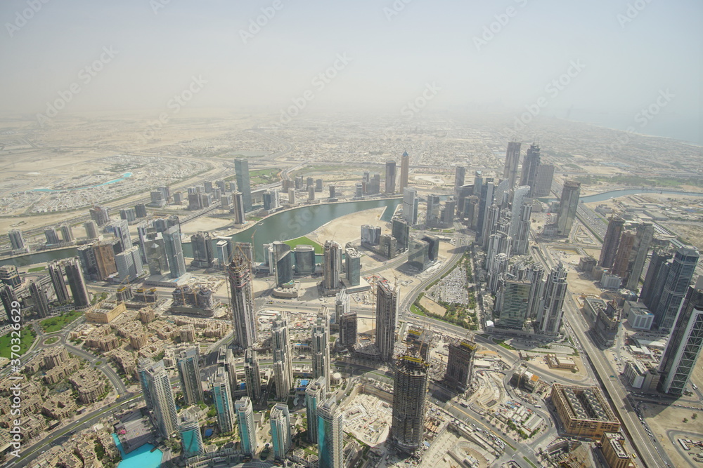 Fototapeta premium Tall buildings in the future city, Dubai. The picture from a hight