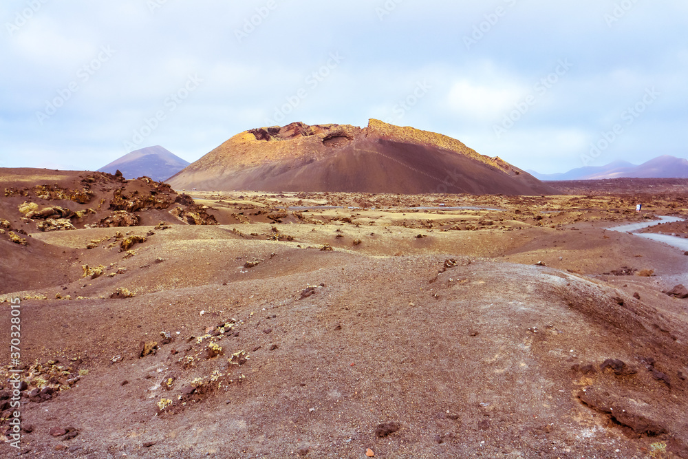 Barren volcanic landscape with El Cuervo (