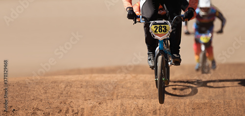 Принти на полотні BMX riders competing in the child class on the off-road circuit