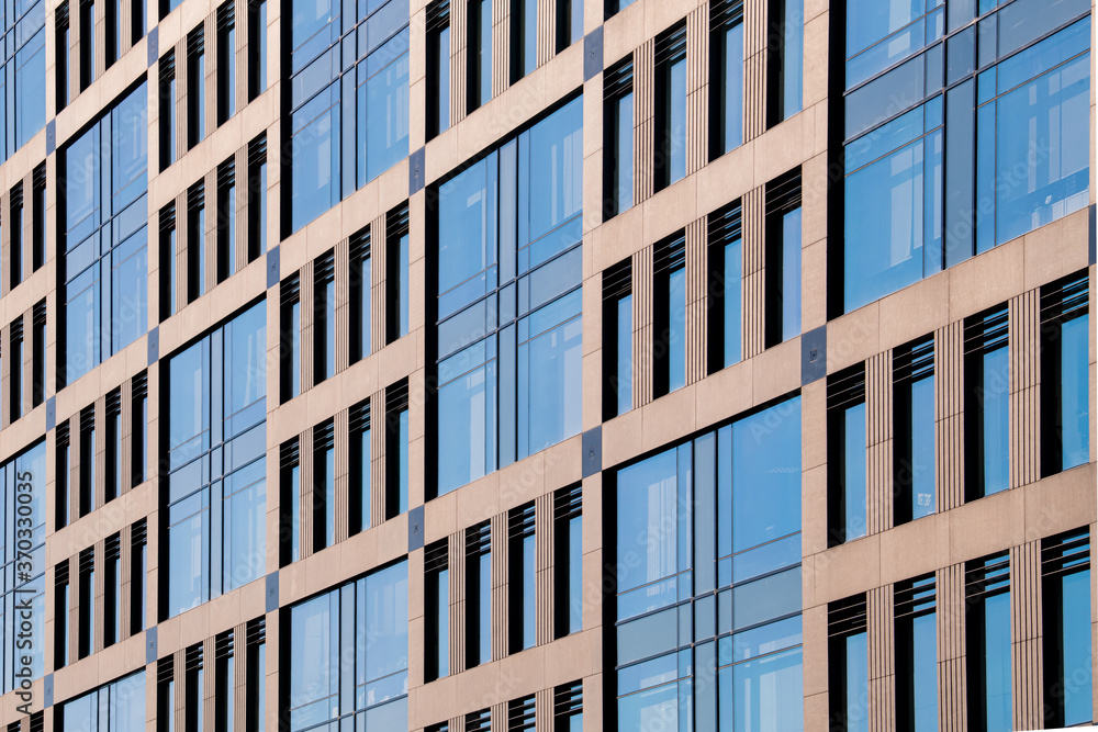 Exterior of modern architecture in the city center. Construction abstract background. Detail of the facade with windows. Exterior of modern architecture in the city center. Construction abstract background. Detail of the facade with windows.