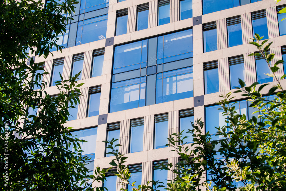 Exterior of modern architecture in the city center. Construction abstract background. Detail of the facade with windows. Exterior of modern architecture in the city center. Construction abstract background. Detail of the facade with windows.