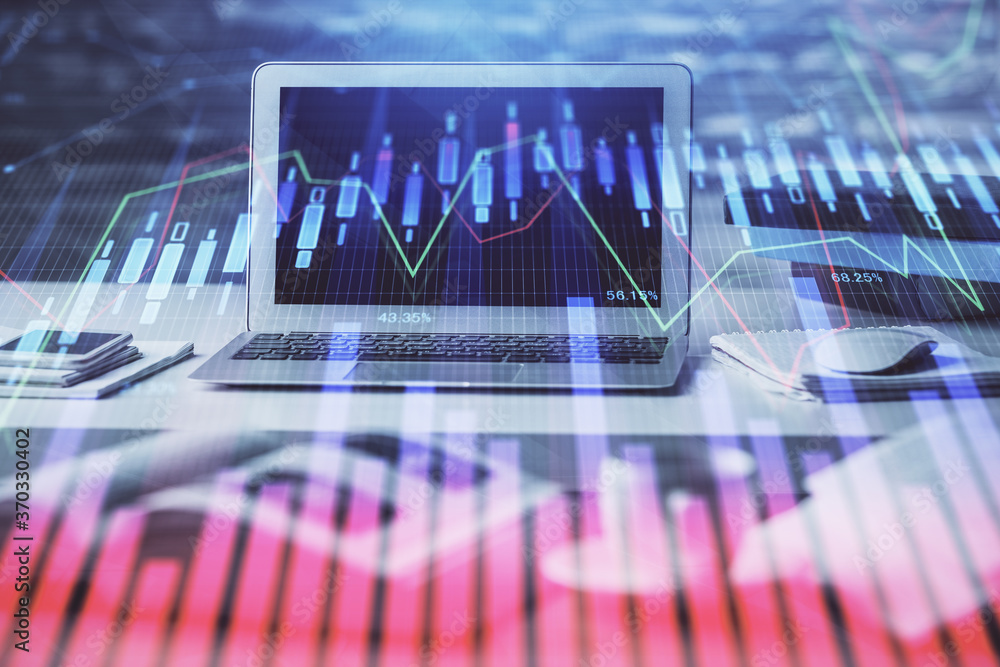 Forex market graph hologram and personal computer on background. Double exposure. Concept of investment.