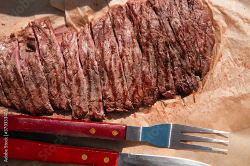 Traditional barbecue steak sliced close-up beef Bavette ready to eat, photo