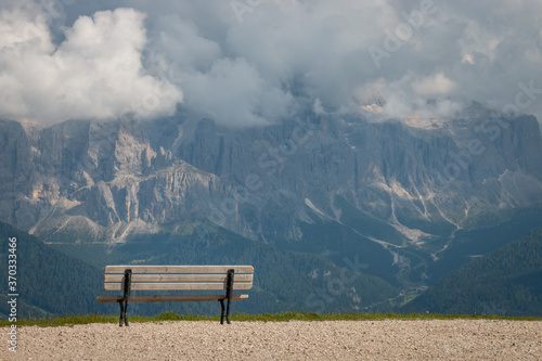 Bild auf Leinwand Empty bench in front of Sella mountain group.