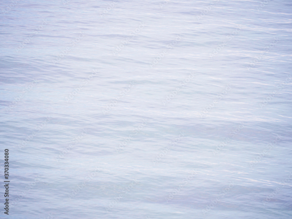 Obraz premium Wave ripples on water sea surface.