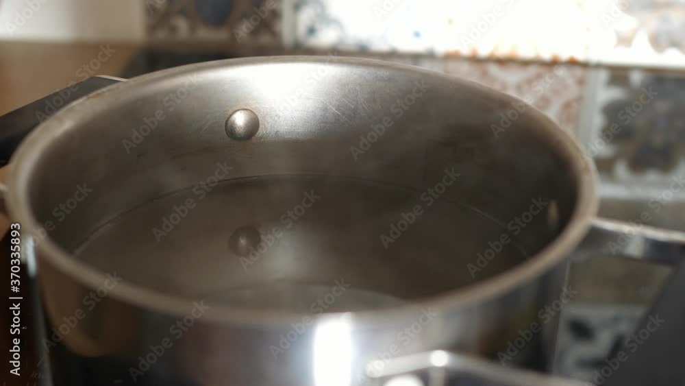 hot water evaporates evaporating steam steaming in the pan pot hot water evaporates evaporating steam steaming in the pan pot