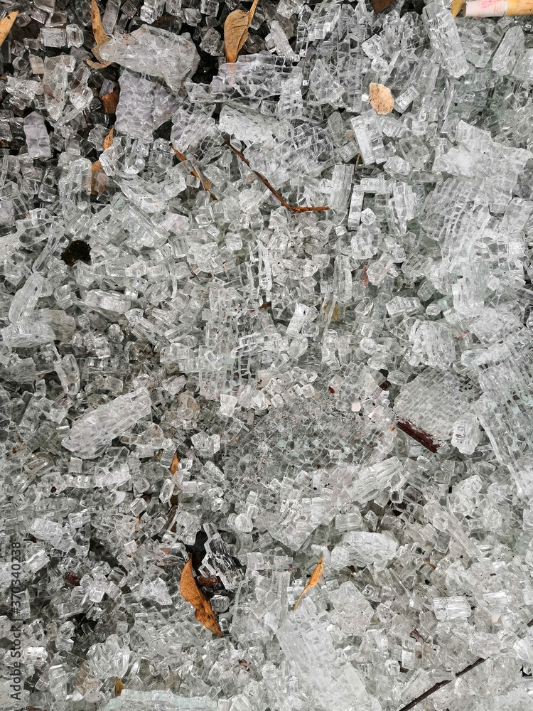broken glass into small crumbs lying on the ground broken glass into small crumbs lying on the ground