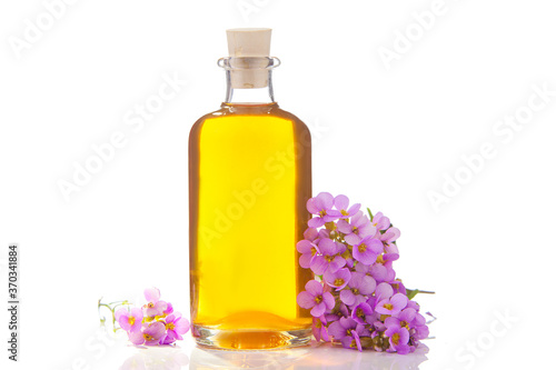 Essential oil of Arabis flower on a White background in beautiful bottle