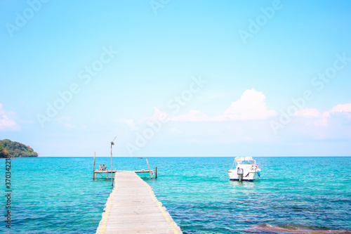 A wooden bridge stretching out into the sea