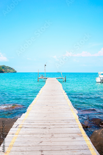 A wooden bridge stretching out into the sea