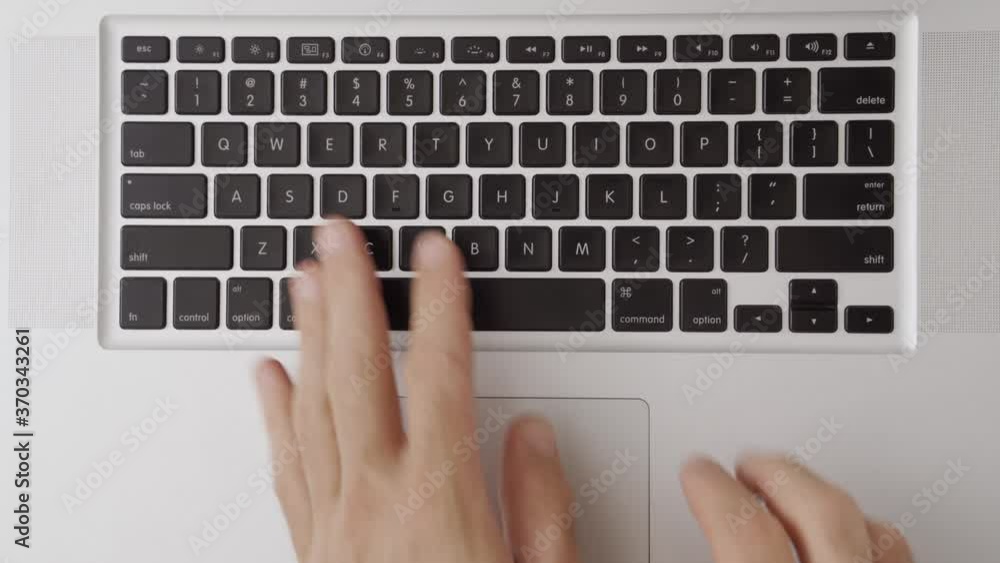 Hands hit keyboard in foolish childish manner or careless angry person. Man doesn't care and tired, stupid typing on laptop computer. Funny quirky slapping buttons nonsense. Close up top shot view Hands hit keyboard in foolish childish manner or careless angry person. Man doesn't care and tired, stupid typing on laptop computer. Funny quirky slapping buttons nonsense. Close up top shot view