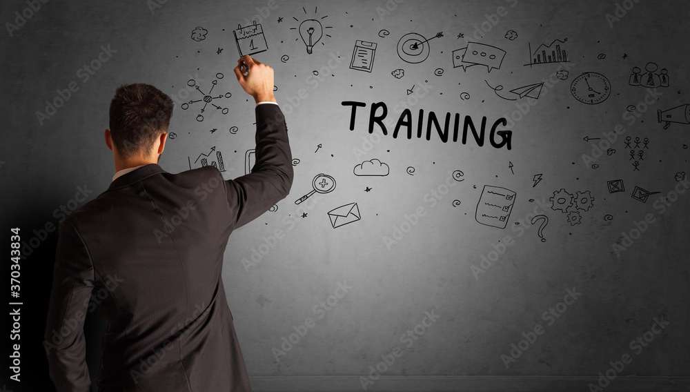 businessman drawing a creative idea sketch with TRAINING inscription, business strategy concept businessman drawing a creative idea sketch with TRAINING inscription, business strategy concept