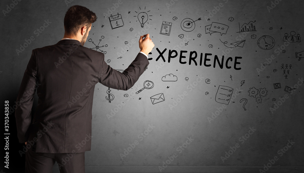 businessman drawing a creative idea sketch with EXPERIENCE inscription, business strategy concept businessman drawing a creative idea sketch with EXPERIENCE inscription, business strategy concept