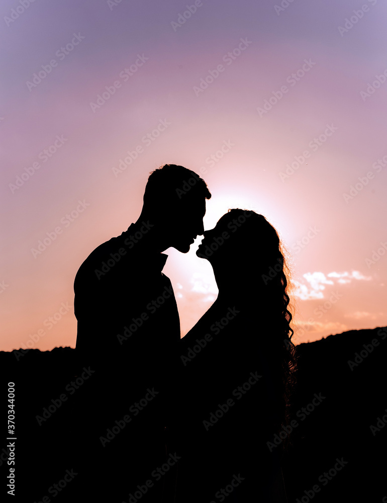 Silhouette of kissing couple