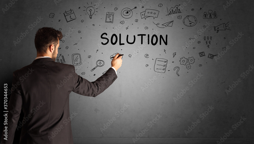 businessman drawing a creative idea sketch with SOLUTION inscription, business strategy concept businessman drawing a creative idea sketch with SOLUTION inscription, business strategy concept