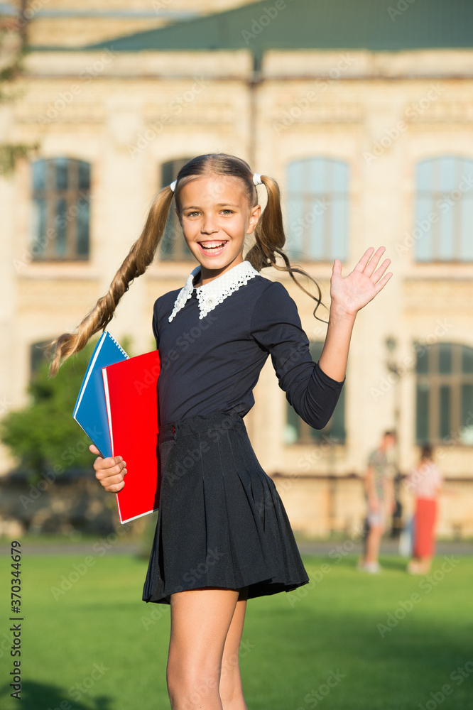Fototapeta premium Perfect girl school student uniform hold books, language courses concept